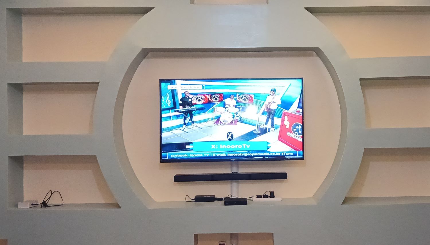 Tv mounted on wall with tilt bracket